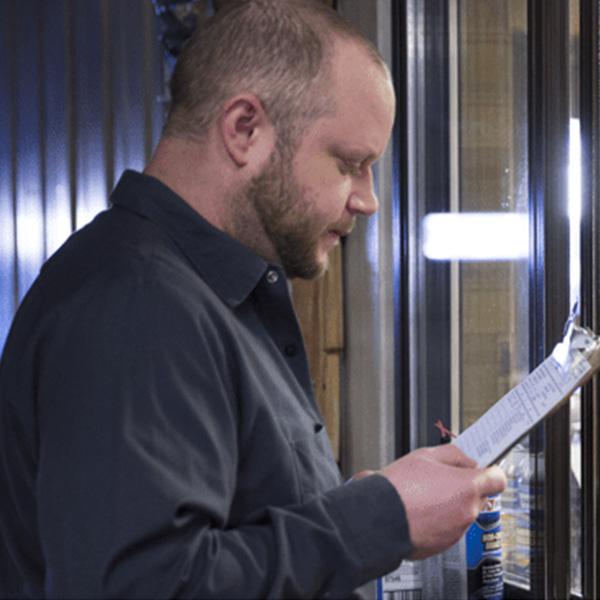 worker reviewing list of things to do